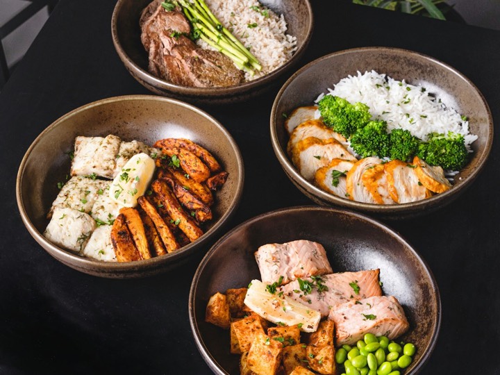 Portions of a batch-cooked meal in boxes